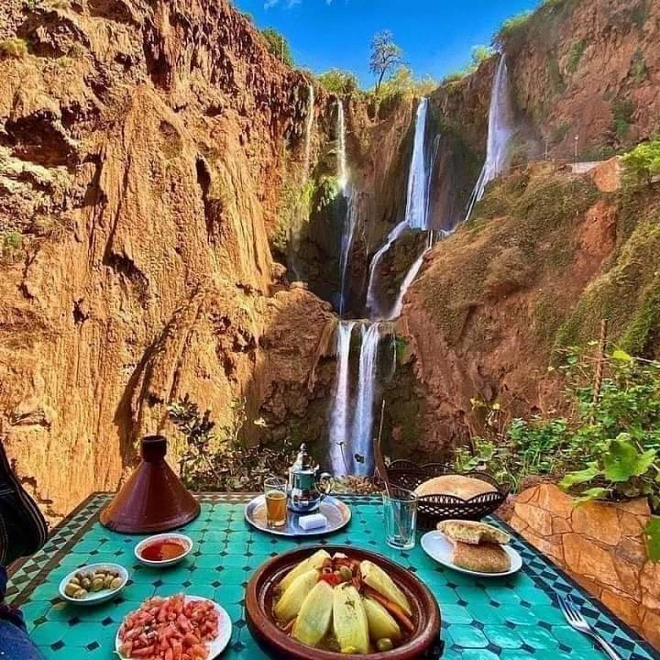 Discover one of Morocco’s natural wonders on this full-day trip to Ouzoud Waterfalls from Marrakech. Enjoy incredible views as you gaze at the stunning 110-metre waterfalls cascading down cliffs. Keep an eye out for the resident monkeys. Embark on a full-day tour to Ouzoud Waterfalls from Marrakech. Learn about Berber culture as you explore the land. Descend winding trails and take in stunning views of the falls on a boat ride. Begin with pickup from your hotel or riad, before setting off for one of North Africa’s most spectacular waterfalls, located 93 miles (150 km) north of Marrakech. Upon arrival in the village of Ouzoud, admire views of the cascades tumbling 360 feet (110 metres) into the pool below. Follow your local guide through olive groves to an argan oil cooperative and learn about Berber culture.  Continue along a network of trails to a viewing point where you can purchase fresh orange juice. Board a traditional boat for a short ride around the pool at the foot of the falls. Next, enjoy a Berber lunch at a local restaurant overlooking the falls. Afterward, take 20 minutes of free time to take photos, admire the views, or browse the souvenir stalls. In the mid-afternoon, climb a set of stairs for your transfer back to Marrakech. PICKUP 08:00 Marrakech hotel/riad DROP-OFF 18:00 Marrakech hotel/riad Here's what's included in your adventure Riad pickup and drop-off in Marrakech Transport by air-conditioned minibus Professional driver Local guide (optional) Boat ride in Ouzoud (optional) Day trip to Ouzoud Waterfalls EXCLUSIONS Food & Drink