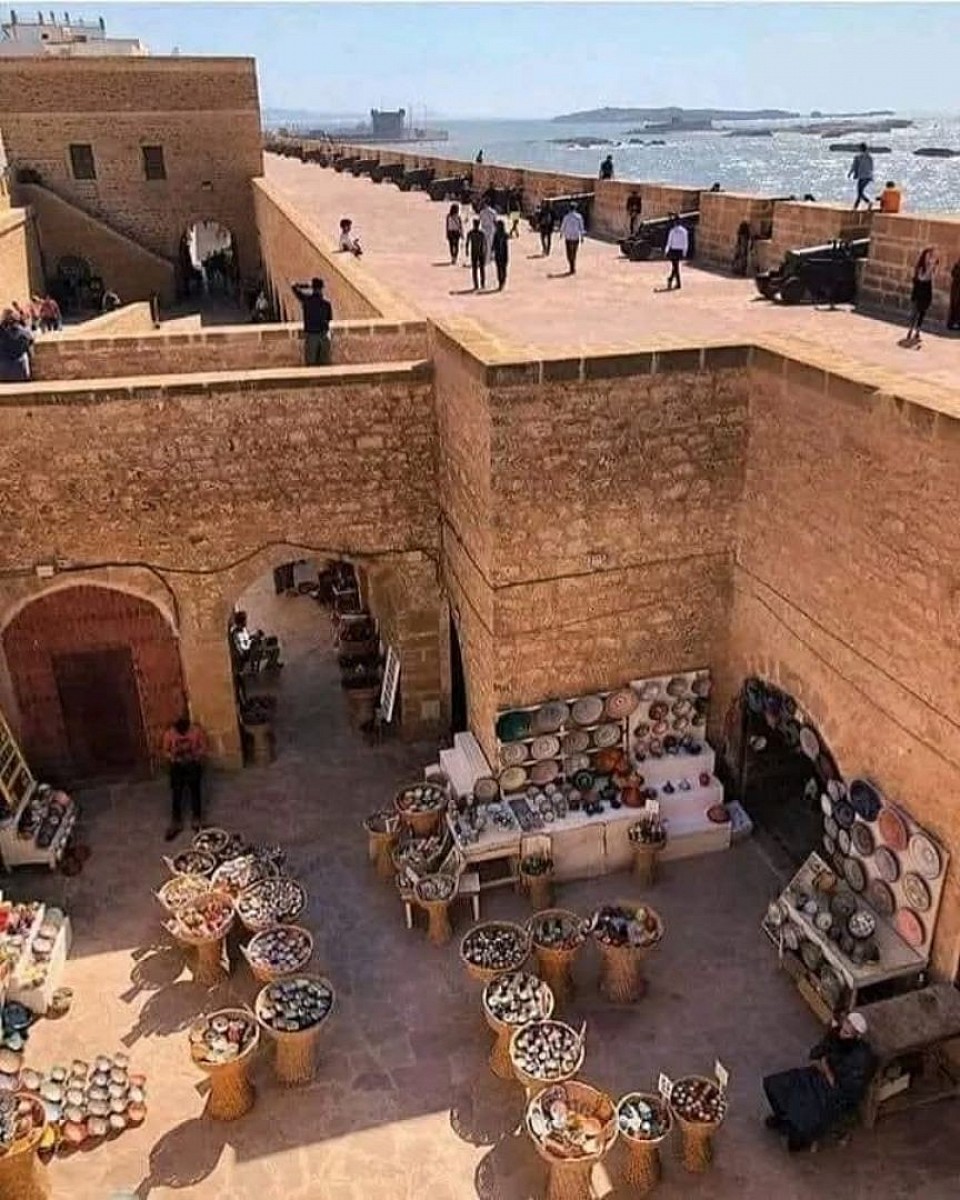 Essaouira is a port and tourist city on the Atlantic coast of Morocco. Its medina (old town) is protected by walls facing the coast. These walls, designed by European engineers, are called Skala de la Kasbah. Ancient metal cannons guard the city.