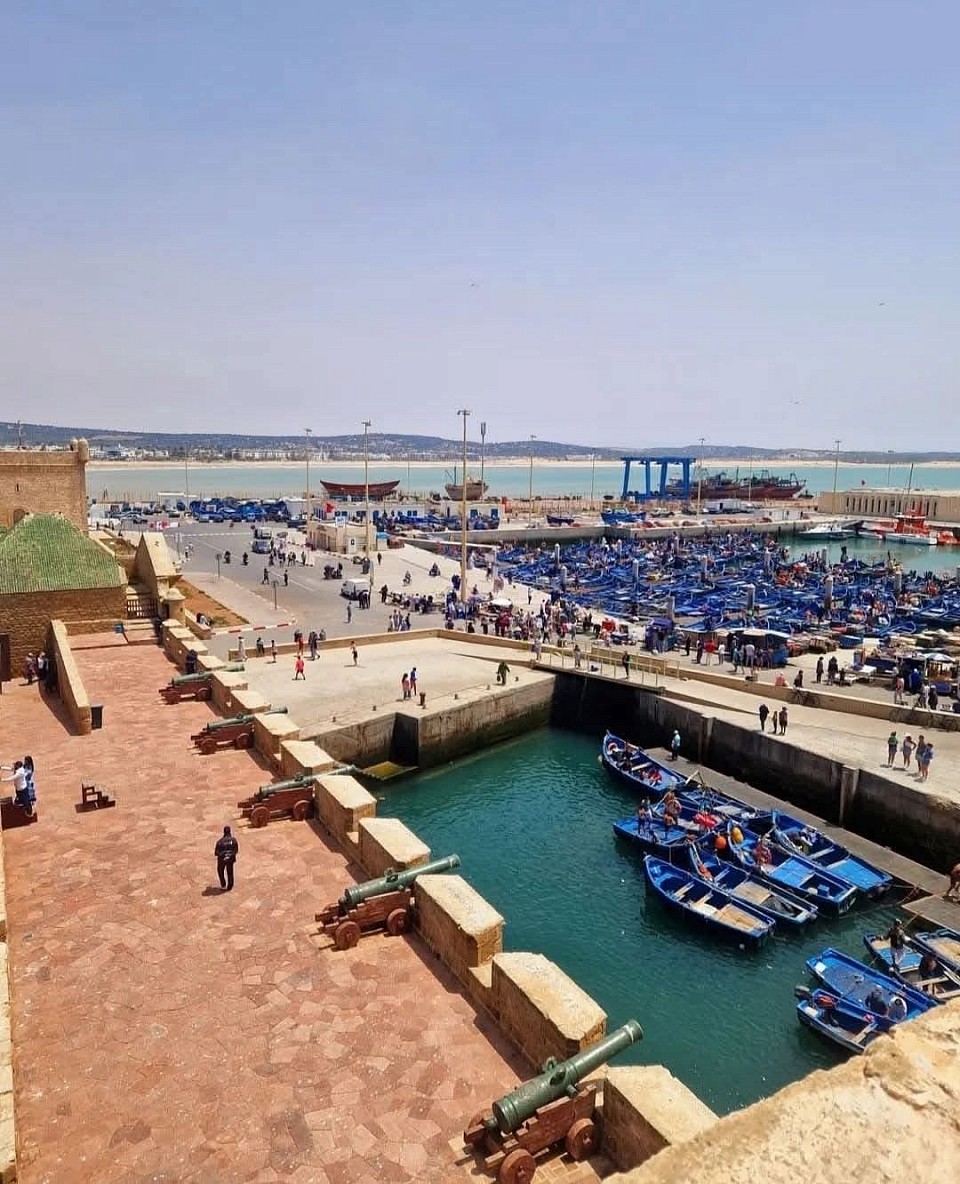 Essaouira is a port and tourist city on the Atlantic coast of Morocco. Its medina (old town) is protected by walls facing the coast. These walls, designed by European engineers, are called Skala de la Kasbah. Ancient metal cannons guard the city.